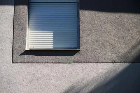 Window of a modern house with the blinds down Stock Photos