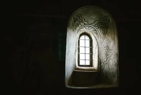 A window with a mural on a black background Foto stock