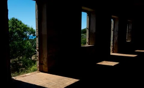 Window of an old abandoned building overlooking the sea Stock Photos