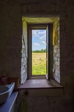 Window of an old brick building Stock Photos