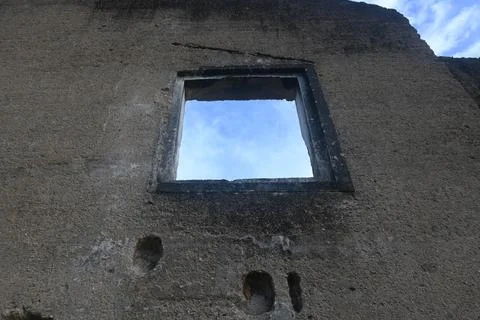 Window in an old building with a blue sky background Stock Photos