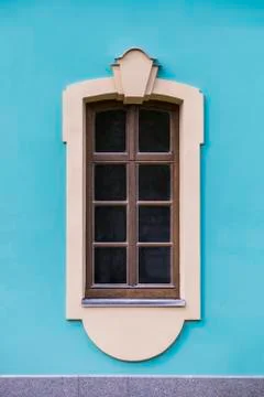 Window of an old building, palace. The frame is made of stucco in the Baroque Stock Photos