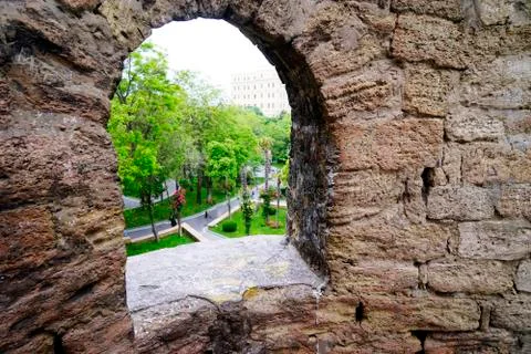 Window in the old stone wall close up. 库存照片