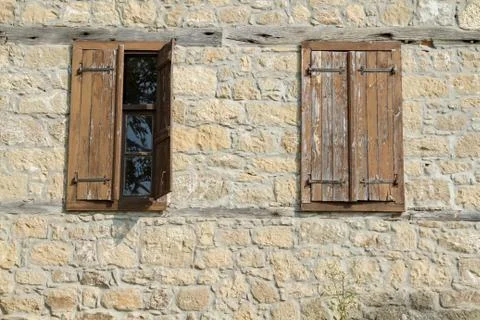 Window on old stone wall Stock Photos