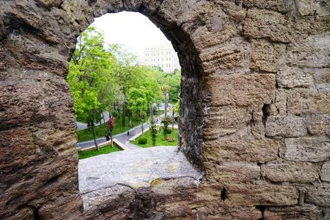 Window in the old stone wall Stock Photos