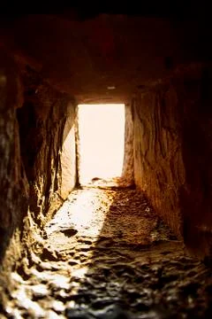 A window in an old wall. A ray of light falls into a dark room Stock Photos