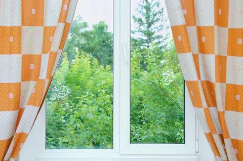 Window with open curtains. Stock Photos