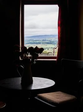 Window opened in a rustic old house. Backlight with outdoor view Stock Photos