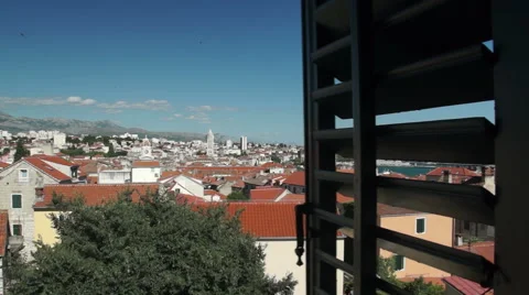 Window opens to reveal view over the city of Split Croatia. Stock Footage 54948572