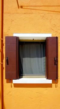 Window on orange wall Stock Photos