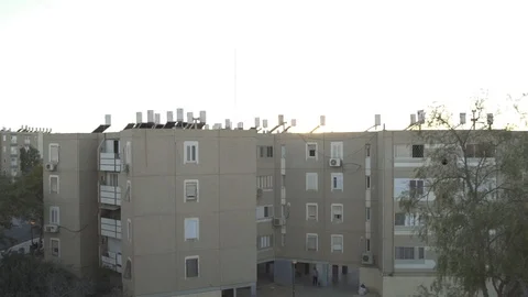 Window overlooking an old and poor apartment complex Stock Footage 102512656