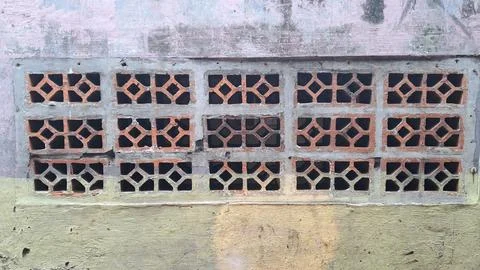 A window with a pattern of squares on it Stock Photos