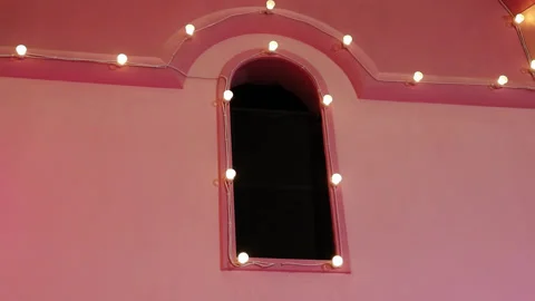 A window in a pink palace under the glare of a spotlight. Stock Footage 267001824