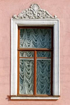 Window on a pink wall. Stock Photos