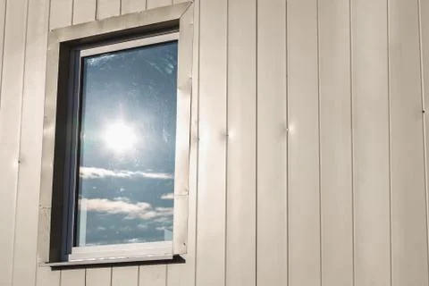 Window in plastic siding wall Stock Photos