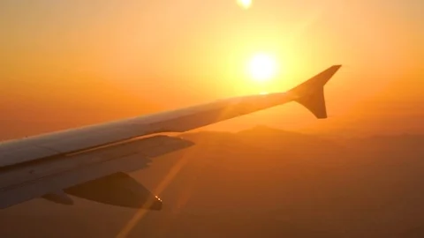 Window point of view of the sunrise in a plane. Location Paris early morning Stock Footage 103578537