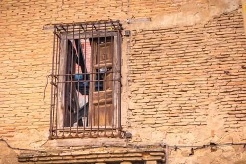 Window protect from rusty metal bar on the brick wall Stock Photos