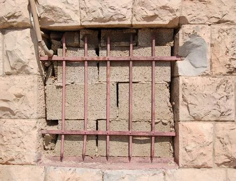 Window put by blocks with a pink lattice Stock Photos