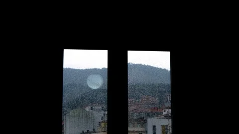 Window with rain and decorative led lights Stock Footage 323928080