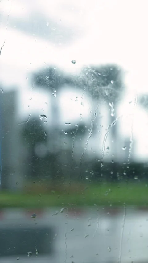 Window With Raindrops, Blurred Background, Vertical Close-Up Shot Stock Footage 292328359