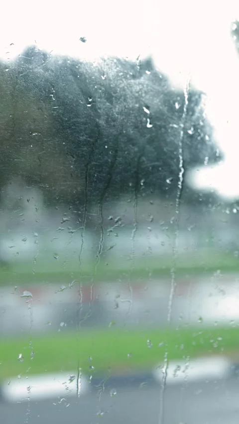 Window With Raindrops, Blurred Background, Vertical Close-Up Shot Stock Footage 292329418
