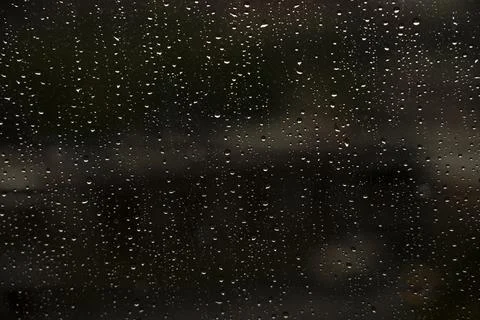 Window with raindrops during rain 10 Stock Photos