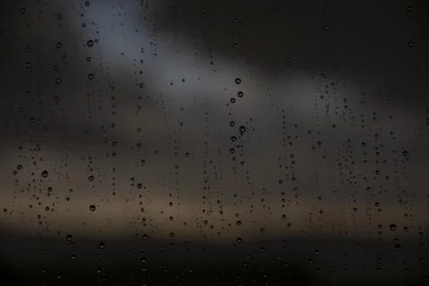 Window with raindrops during rain Stock Photos