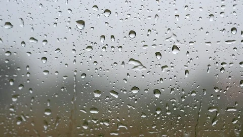 Window with raindrops during the rain. Slow motion shot Video stock 103578790