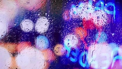 Window Raindrops Wet Weather Storm Neon Lights City Palm Reader Stock Footage 144719475