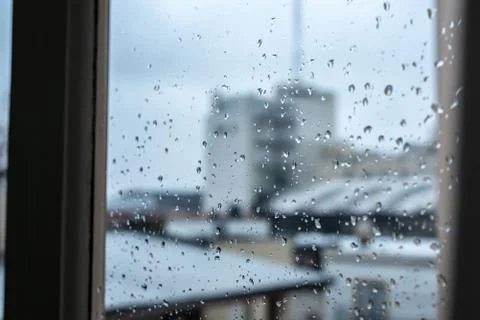 Window on a rainy day with small drops in it Stock Photos