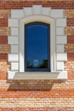 Window in a red brick wall Stock Photos