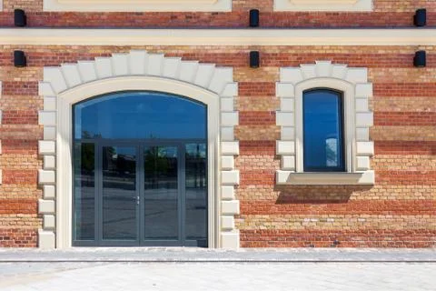 Window in a red brick wall Stock Photos