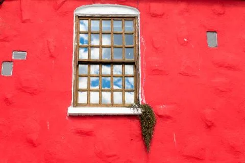 Window on red wall Stock Photos