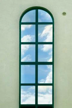 A window with a reflection of the sky Stock Photos