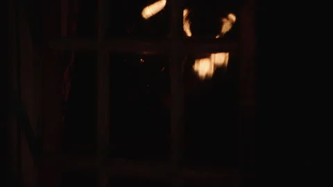Window Reflection of Torches carried by hand in a dark historical setting - 4k Stock Footage 262395757