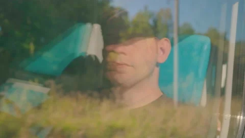 Window reflection of young handsome Caucasian man travel Stock Footage 226128992