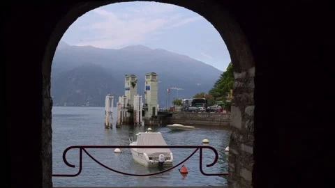 A window on the road wall with view to the Como lake and Varenna ferry port Stock Footage 138264463