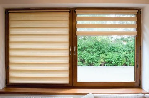 Window roller, duo system day and night.  Cozy home interior. Stock Photos