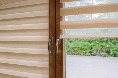 Window roller, duo system day and night.  Cozy home interior. Stock Photos