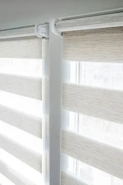 Window roller duo system day and night. Close up on roll curtains indoor. Stock Photos