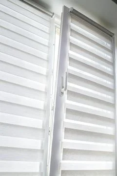 Window roller duo system day and night. Close up on roll curtains indoor. Stock Photos