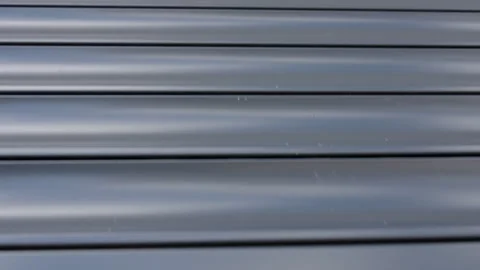 Window roller shutter closing over glass window Stock Footage 334673234