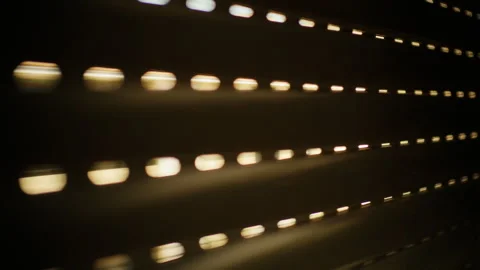 Window roller shutter partially closed, creating horizontal lines of light and Stock Footage 343267449