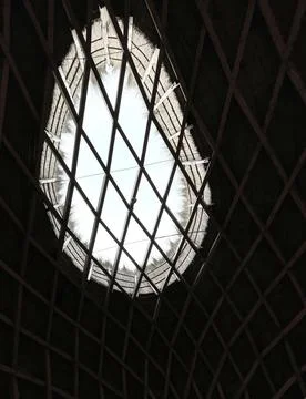 Window in a roof of straw made with triangular wood Stock Photos