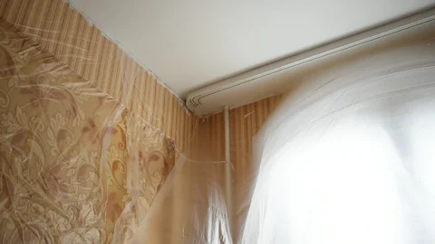 Window in the room is covered with cellophane, a draft Stock Footage 125367423