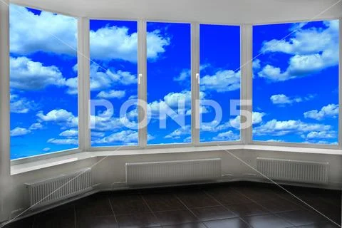 Window of room overlooking blue sky with white clouds. Heavenly landscape Stock Photos