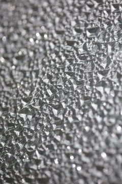 Window rough glass wild surface abstract close up background fine modern ar.. Stock Photos