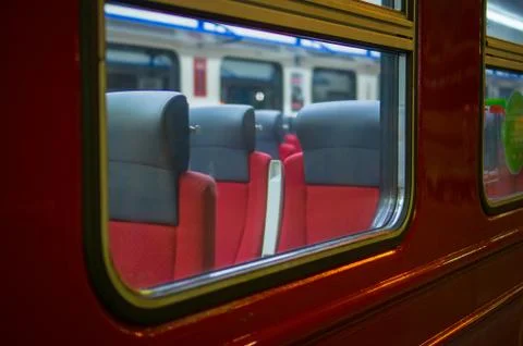Window with rows of seats in modern suburb commuter train Foto stock