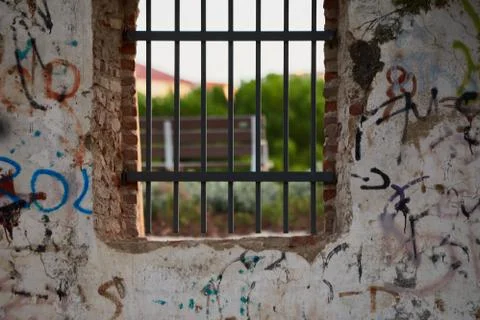 Window with rusty bars and graffiti Stock Photos