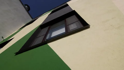 Window on school building facade with color pattern Vídeos de archivo 283383874